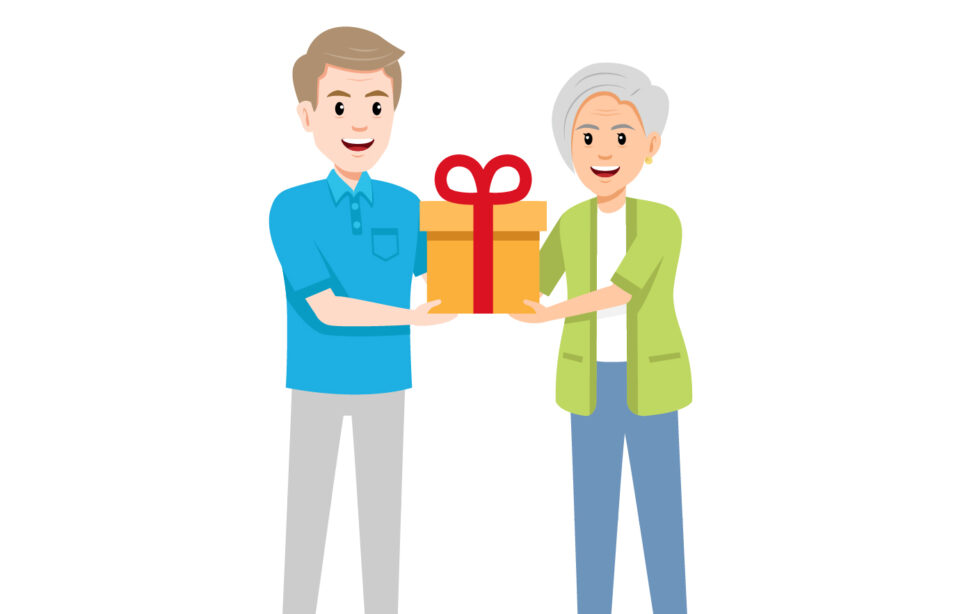 Middle age man gives present to older lady
