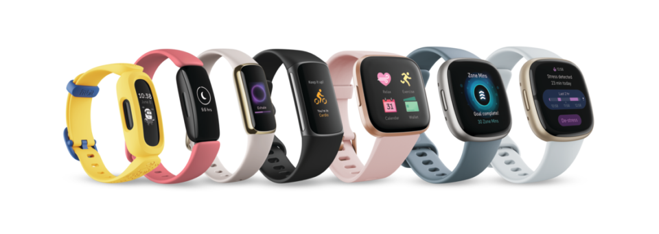 Fitbit trackers in a line from small to large
